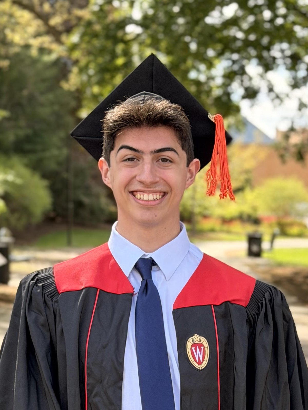 Diego Rodriguez in University of Wisconsin–Madison graduation cap and gown